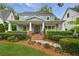 Inviting home with a covered front porch, brick steps, and lush landscaping enhancing curb appeal at 1349 Middlesex Ne Ave, Atlanta, GA 30306