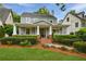 Beautifully landscaped front yard leading to a charming home with a classic covered porch at 1349 Middlesex Ne Ave, Atlanta, GA 30306