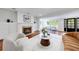 Bright living room featuring hardwood floors, a fireplace, and ample seating areas at 1349 Middlesex Ne Ave, Atlanta, GA 30306