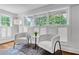 Cozy sitting area featuring lots of windows with natural light and stylish furniture at 1349 Middlesex Ne Ave, Atlanta, GA 30306