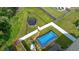 Aerial view of a backyard featuring a trampoline, playset, and above-ground pool at 2267 Clapton Ct, Jonesboro, GA 30236