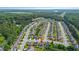 A high-angle aerial view shows an orderly neighborhood surrounded by verdant landscapes, offering a peaceful residential setting at 2267 Clapton Ct, Jonesboro, GA 30236
