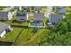 Aerial view of a fenced-in backyard featuring a trampoline, pool, and patio at 2267 Clapton Ct, Jonesboro, GA 30236
