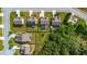 Aerial shot of neighborhood backyards featuring a mix of green lawns, trees, above-ground pools, and outdoor play areas at 2267 Clapton Ct, Jonesboro, GA 30236