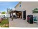 Backyard with a covered patio, grill, and access door to the home's interior at 2267 Clapton Ct, Jonesboro, GA 30236