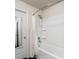 Bathroom featuring a shower-tub combo with a shower curtain and a glass-paneled door at 2267 Clapton Ct, Jonesboro, GA 30236