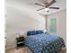 Bedroom featuring a ceiling fan, neutral walls and carpet, and a bed with blue patterned bedding at 2267 Clapton Ct, Jonesboro, GA 30236