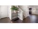 Inviting foyer with dark hardwood floors, staircase, and stylish console table at 2267 Clapton Ct, Jonesboro, GA 30236