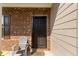 Welcoming front entrance featuring a black metal security door and decorative brick accents at 2267 Clapton Ct, Jonesboro, GA 30236