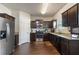 Modern kitchen with stainless steel appliances, dark cabinetry, and granite countertops at 2267 Clapton Ct, Jonesboro, GA 30236