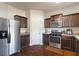 Kitchen featuring stainless steel refrigerator and appliances, plus granite countertops at 2267 Clapton Ct, Jonesboro, GA 30236