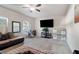 Cozy living room with carpeted floors and comfortable seating arrangement at 2267 Clapton Ct, Jonesboro, GA 30236