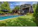 Stunning backyard with a pool, putting green, and outdoor seating area perfect for entertaining at 2406 Glenwood Ne Dr, Atlanta, GA 30305
