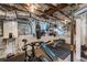 Finished basement featuring gym with exercise equipment, exposed ducts, and concrete walls at 2406 Glenwood Ne Dr, Atlanta, GA 30305
