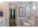 Bathroom showcasing a shower-tub combo and a glimpse into the adjacent bedroom at 2406 Glenwood Ne Dr, Atlanta, GA 30305