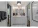 Dual vanity bathroom with modern fixtures, mirrors, and lighting at 2406 Glenwood Ne Dr, Atlanta, GA 30305
