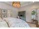 Bedroom showcasing a decorative light fixture, desk, and a serene view at 2406 Glenwood Ne Dr, Atlanta, GA 30305
