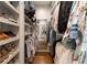 Organized walk-in closet with shelving and hanging space for clothes and shoes at 2406 Glenwood Ne Dr, Atlanta, GA 30305