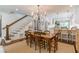Elegant dining area with chandelier and easy access to kitchen at 2406 Glenwood Ne Dr, Atlanta, GA 30305