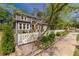 Beautiful two-story home with a manicured lawn, picket fence, and lovely landscaping at 2406 Glenwood Ne Dr, Atlanta, GA 30305