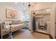 Cozy hallway with daybed, laundry area, and stylish decor at 2406 Glenwood Ne Dr, Atlanta, GA 30305