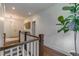 Upstairs hallway with hardwood floors and natural light at 2406 Glenwood Ne Dr, Atlanta, GA 30305