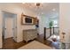 Upstairs hallway with hardwood floors, a dresser with shuttered TV and decor at 2406 Glenwood Ne Dr, Atlanta, GA 30305