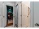 Hallway view of an office and bathroom showcasing interior design with hardwood floors and an elevator at 2406 Glenwood Ne Dr, Atlanta, GA 30305
