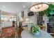 Bright kitchen featuring white cabinetry, stainless steel appliances, marble backsplash, and an adjacent breakfast area at 2406 Glenwood Ne Dr, Atlanta, GA 30305