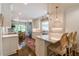 Modern kitchen with white cabinets, quartz countertops, and stainless steel appliances at 2406 Glenwood Ne Dr, Atlanta, GA 30305