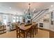 Open concept living room with fireplace, dining space, and large windows at 2406 Glenwood Ne Dr, Atlanta, GA 30305