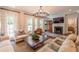 Bright and airy living room with fireplace, comfortable seating, and hardwood floors at 2406 Glenwood Ne Dr, Atlanta, GA 30305