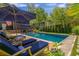 Enjoy lounging by the pool surrounded by lush landscaping and a charming patio at 2406 Glenwood Ne Dr, Atlanta, GA 30305