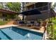A refreshing pool with water features is surrounded by patio and outdoor living spaces at 2406 Glenwood Ne Dr, Atlanta, GA 30305