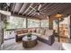 Spacious screened porch with comfortable seating, wood ceiling, and outdoor access to the kitchen and backyard at 2406 Glenwood Ne Dr, Atlanta, GA 30305