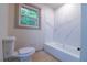 Clean bathroom featuring white tile and a bathtub at 4396 Greenleaf Cir, Atlanta, GA 30331