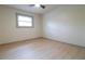 Inviting bedroom with a window, wood flooring, and fan at 4396 Greenleaf Cir, Atlanta, GA 30331