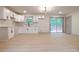 Modern kitchen with white cabinets, black hardware, and stainless steel appliances; sliding glass door at 4396 Greenleaf Cir, Atlanta, GA 30331