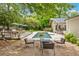 Inviting backyard showcasing a refreshing pool, deck, and shaded seating for outdoor enjoyment and relaxation at 5785 Timberlane Ter, Sandy Springs, GA 30328