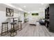 Finished basement with hardwood floors, modern furniture, and lots of natural light from a window at 5785 Timberlane Ter, Sandy Springs, GA 30328