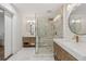 Bright and modern bathroom with double vanity, glass shower, and stone accents at 5785 Timberlane Ter, Sandy Springs, GA 30328