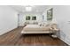 Bright bedroom with natural light, hardwood floors, and a decorative chandelier at 5785 Timberlane Ter, Sandy Springs, GA 30328