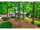 Well-maintained home with a carport and landscaped yard, surrounded by mature trees at 5785 Timberlane Ter, Sandy Springs, GA 30328