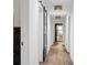 Hallway with hardwood floors and a black framed sliding door, and decorative ceiling lights at 5785 Timberlane Ter, Sandy Springs, GA 30328