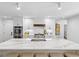 Bright kitchen with a large marble island, stainless steel appliances, and modern fixtures, perfect for cooking at 5785 Timberlane Ter, Sandy Springs, GA 30328