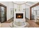 Bright living room with white walls, wood floors, fireplace, and open layout, bathed in natural light at 5785 Timberlane Ter, Sandy Springs, GA 30328