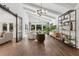 Spacious living room boasting hardwood floors, vaulted ceiling, and stylish modern furniture at 5785 Timberlane Ter, Sandy Springs, GA 30328