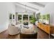 Comfortable living area with a neutral color palette, plush seating, and large windows at 5785 Timberlane Ter, Sandy Springs, GA 30328