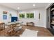 Bright home office with hardwood floors, large windows, a modern desk, and built-in shelving at 5785 Timberlane Ter, Sandy Springs, GA 30328