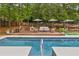 Beautiful backyard pool area with stylish seating, lush surroundings, and perfect for outdoor entertainment and relaxation at 5785 Timberlane Ter, Sandy Springs, GA 30328